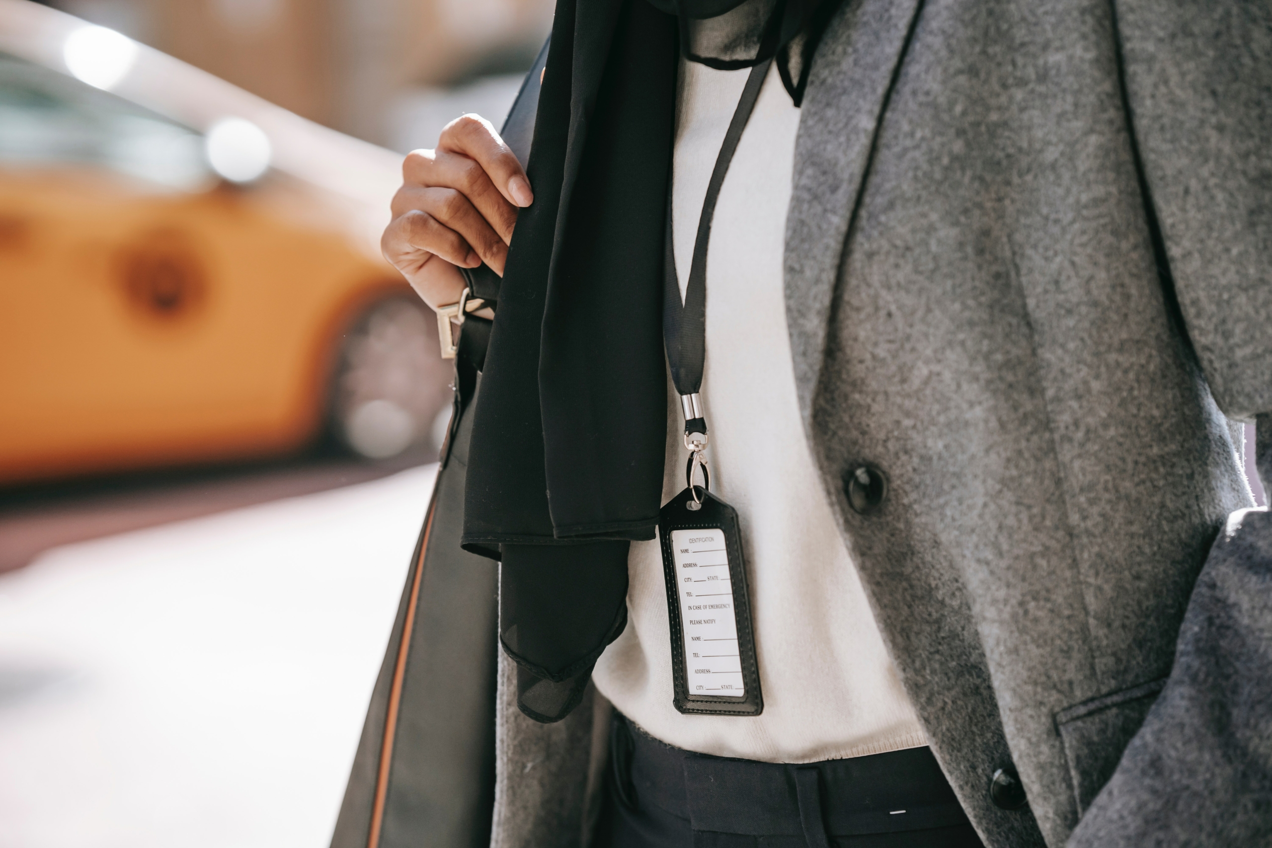 hugo-boss-man-walking-in-causal-suit-grey-scarf